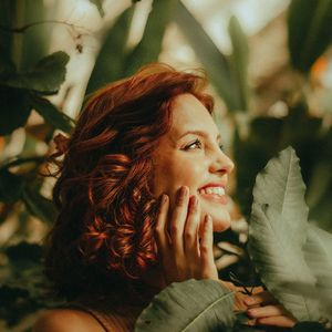 Portrait of Daryna Ponomarenko, a wellness coach, smiling warmly.